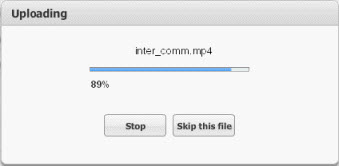 The Uploading window displays the progress bar. Click Stop or Skip This File to halt the upload process.