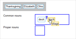The three answers in the target are "desk," "truck," and "village." "Village" is being dragged to the left. When "village" is dropped, it will be in the spot marked by the blue arrow.